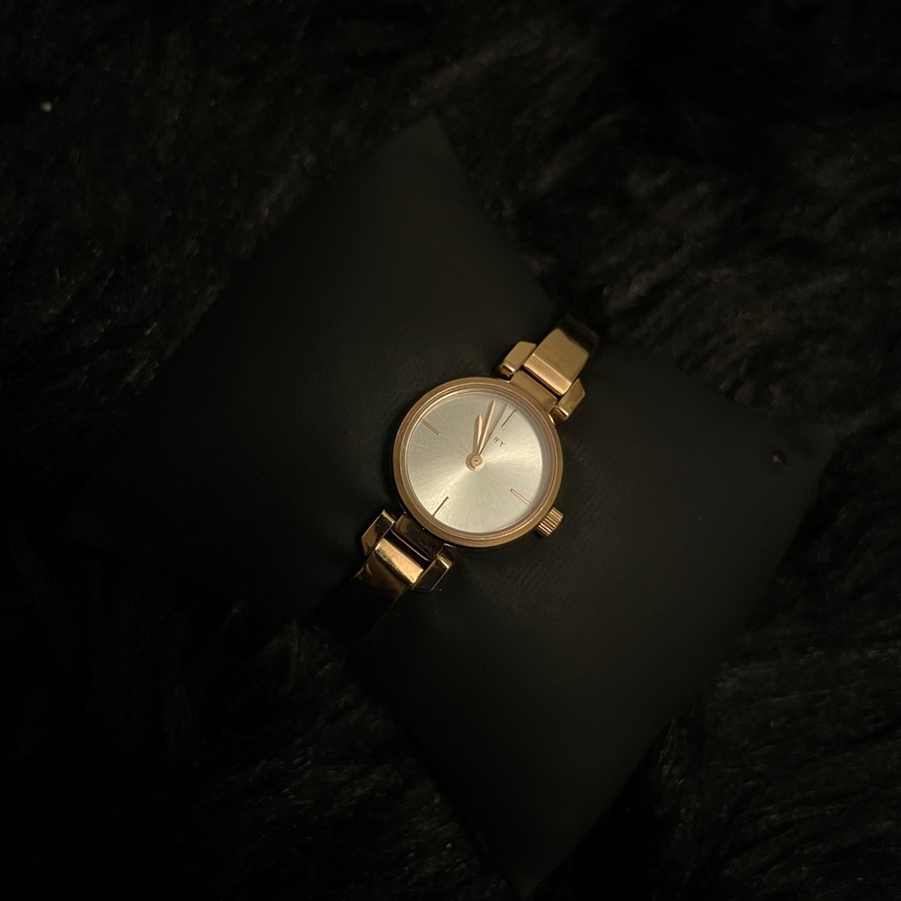 Used/excellent condition-beautiful DKNY gold rose